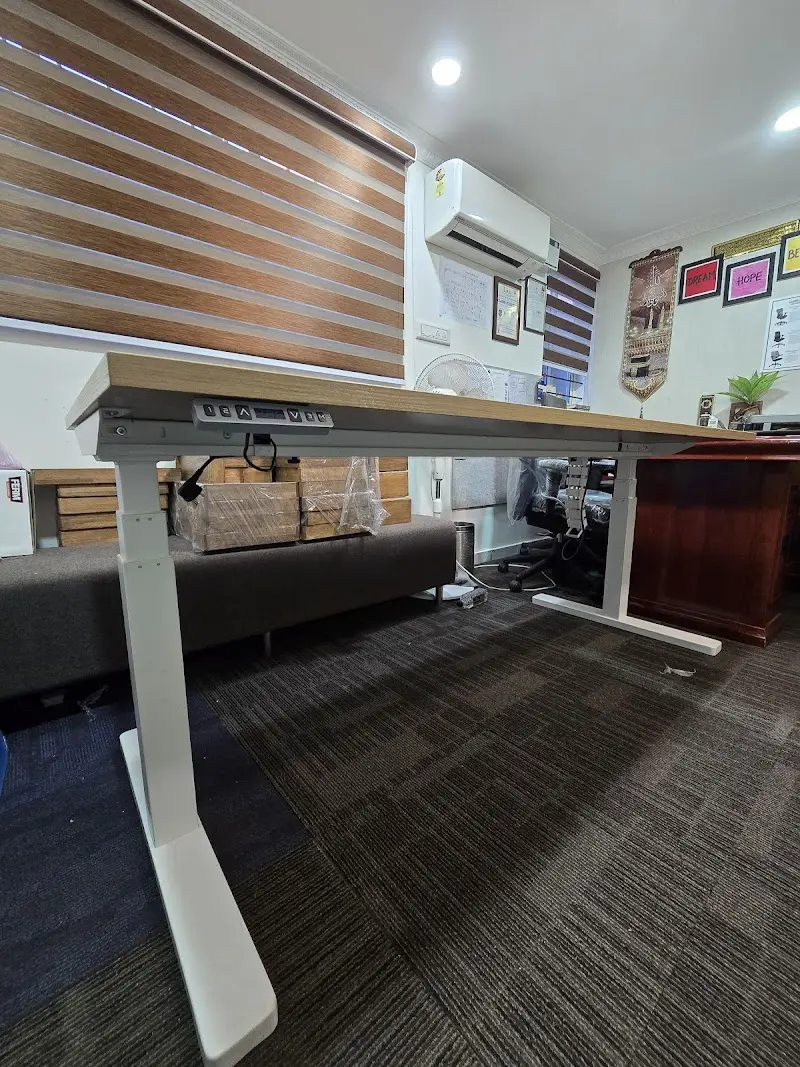 Refurbished office chairs and desks on display at Styleex Furniture, Bengaluru